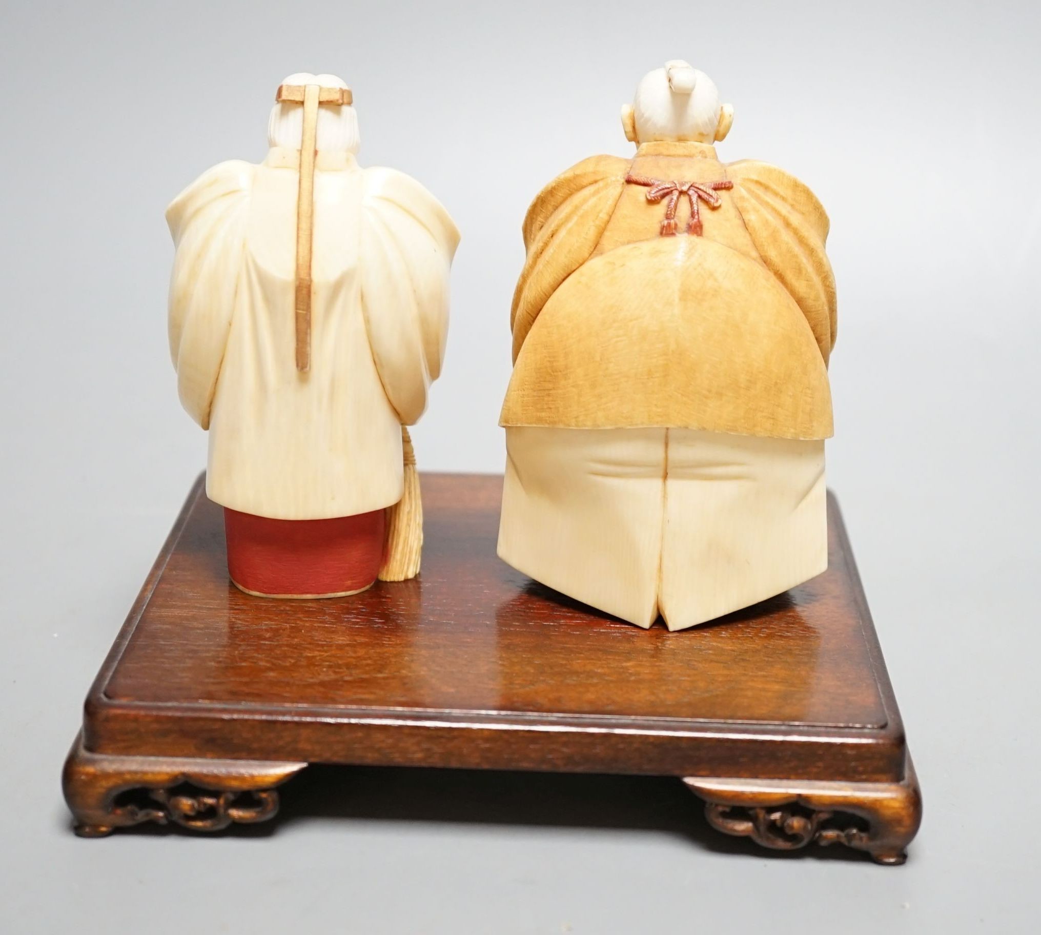 Two Japanese stained ivory figures of court servants, Taisho/early Showa period, signed - tallest 11cm